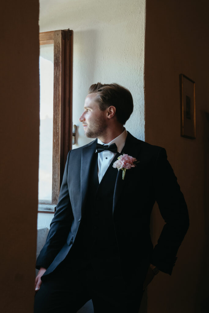 groom getting ready at castello di ristonchi wedding