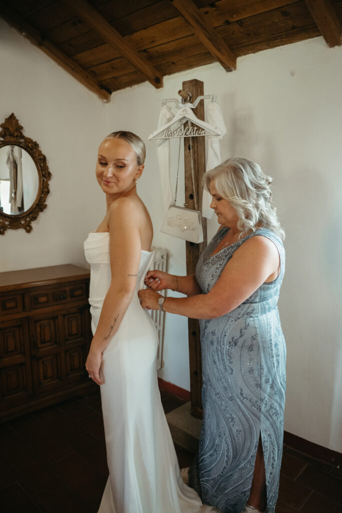 bride getting ready at castello di ristonchi wedding 