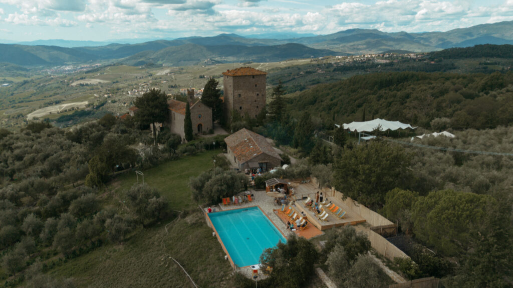 italian destination wedding pool party at castello di ristonchi