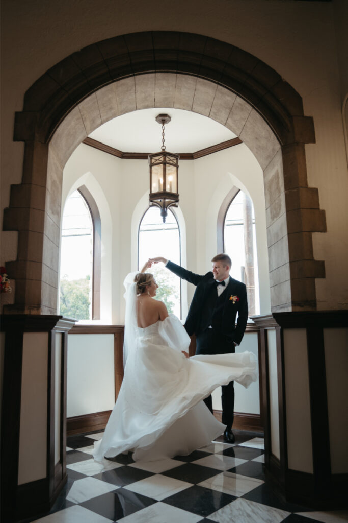 Groom spins bride, reflecting on their decision to choose the perfect wedding photographer to capture their style. 