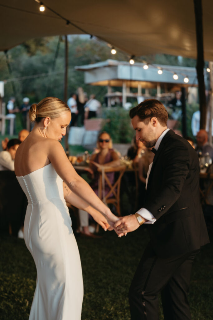 The bride and groom share their first dance at their wedding. 