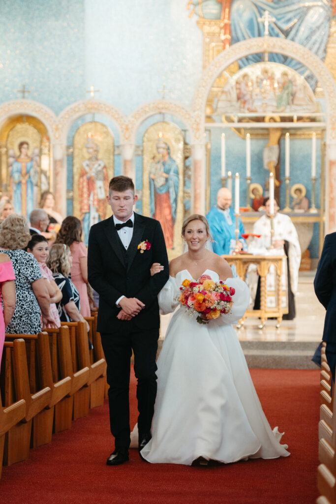 bride and groom leaving wedding ceremony at st nicholas in cincinnati