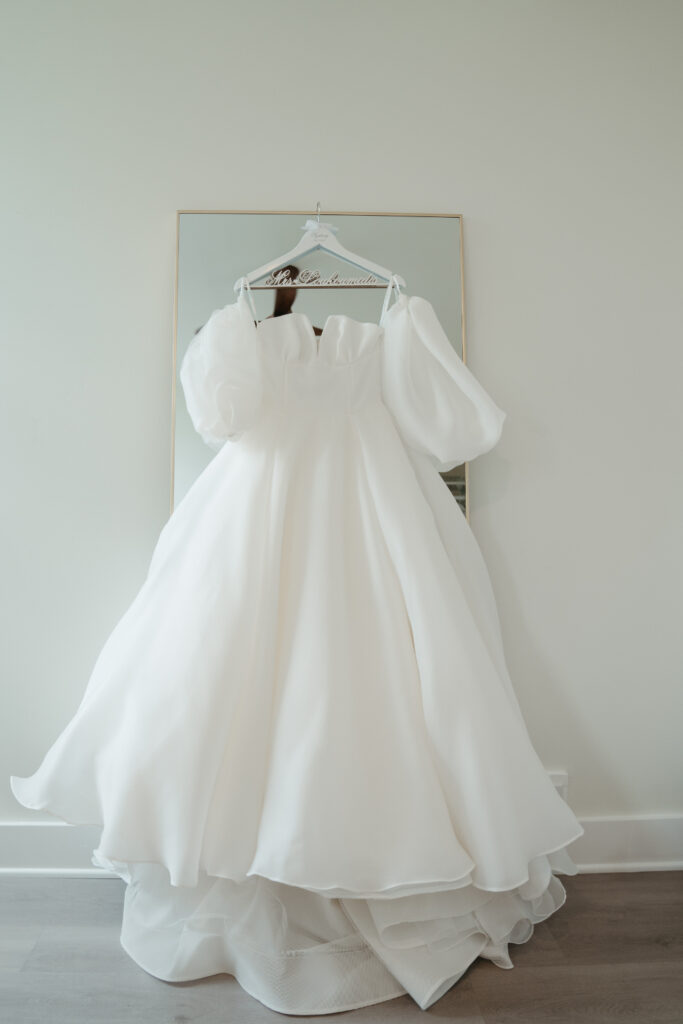 brides wedding dress hanging up