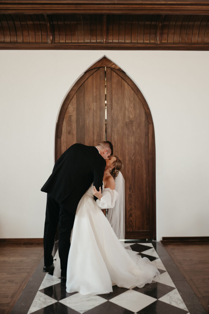 bride and groom kissing at the palomar cincinnati