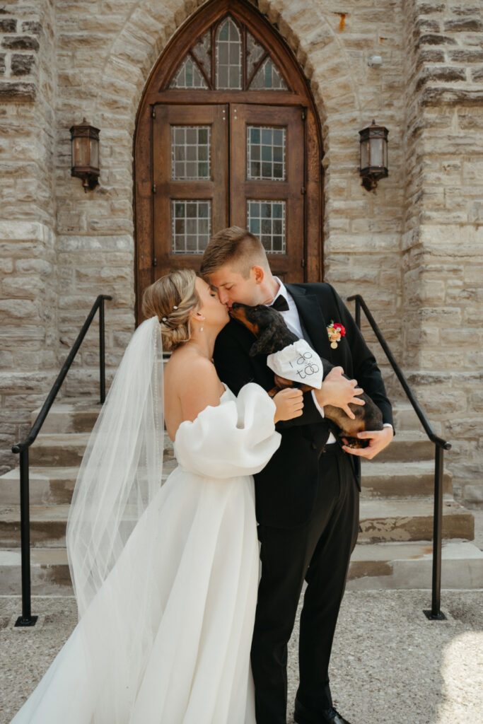 outdoor portraits of bride and groom with their dog