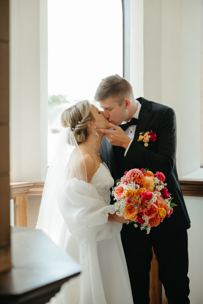 bride and groom kissing at st nicholas cincinnati