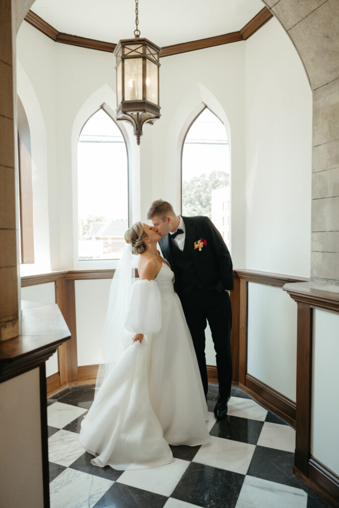 bride and groom kissing at st nicholas cincinnati