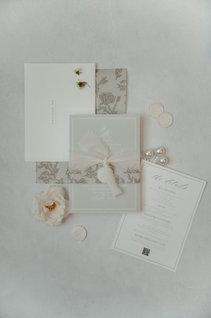 Elegant wedding invitations with floral details.