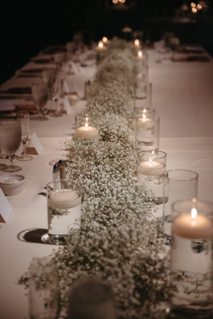 reception table at cincinnati club with white roses and baby's breath