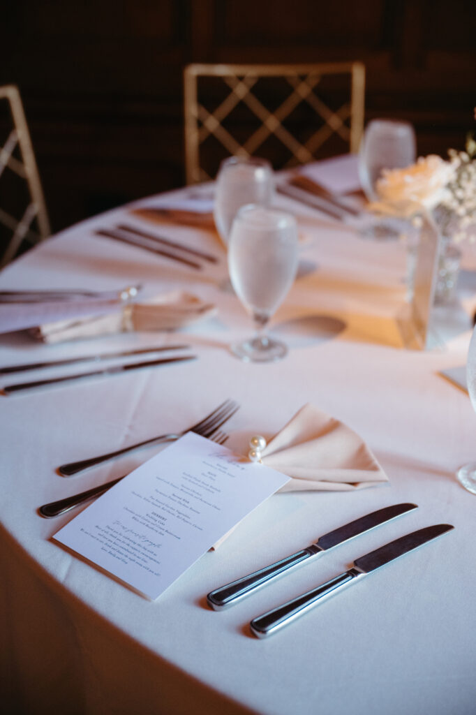 reception table at cincinnati club with white roses and baby's breath