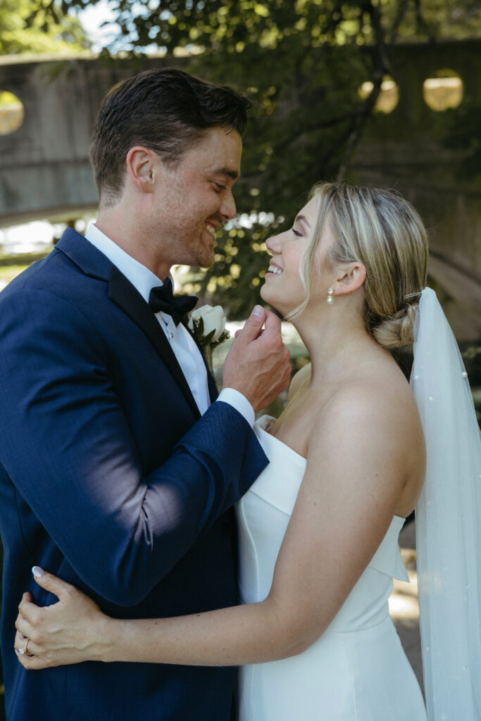 Close-up of couple smiling at each other.
