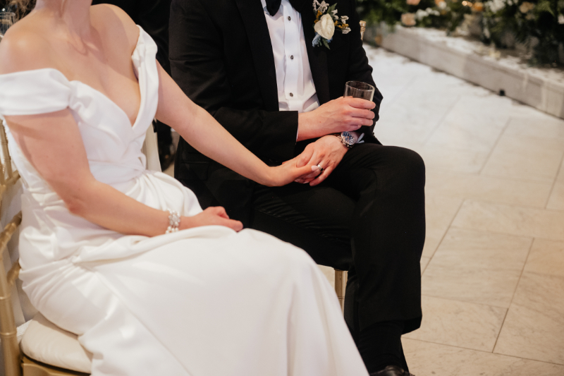 bride and groom holding hands