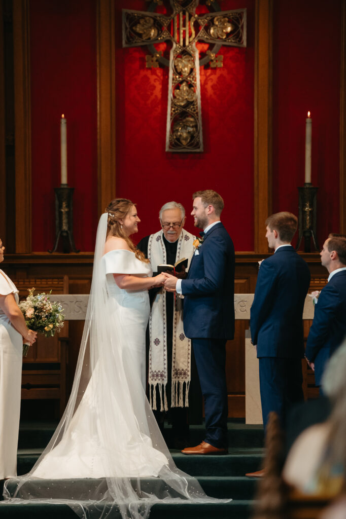 real-wedding-feature bride and groom standing towards each other saying their I do's
