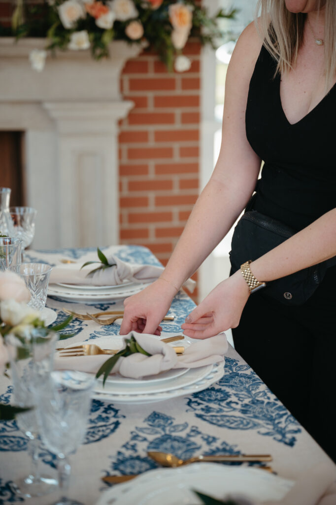 wedding-planning-secrets a wedding planner placing final touches while sharing wedding planning secrets