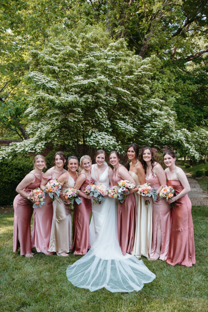 real-wedding-feature bride with her bridesmaids all dressed in a pretty blush pink