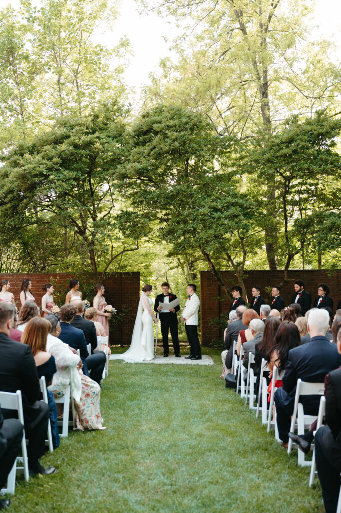 real-wedding-feature bride and groom saying their vows during their garden ceremony