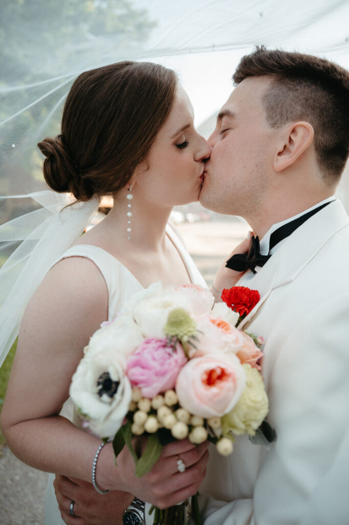 real-wedding-feature husband and wife kissing during golden hour