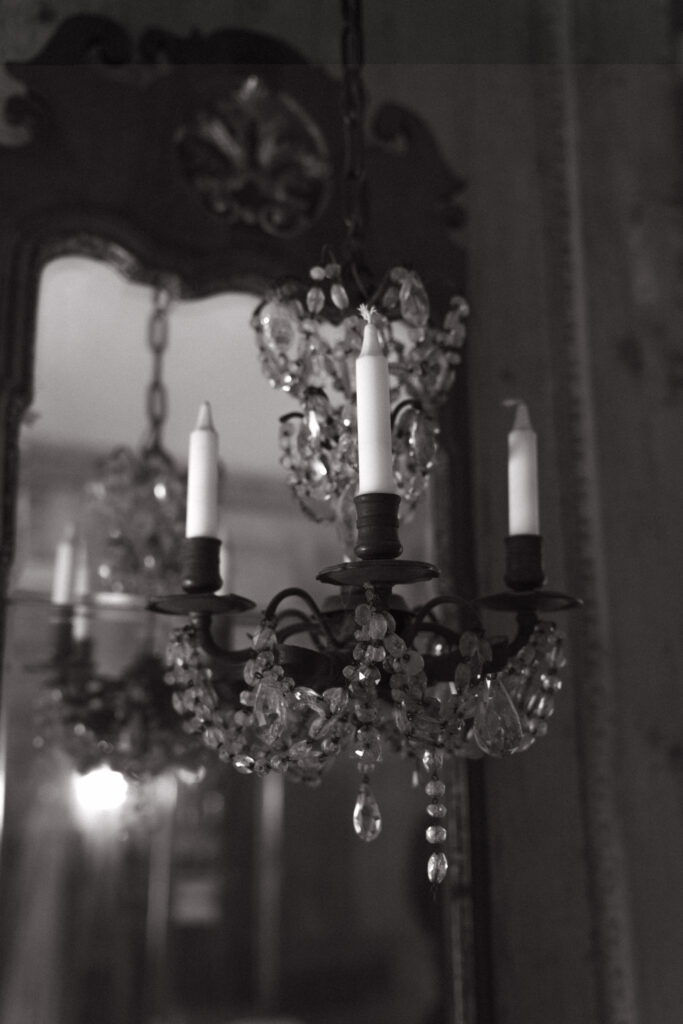 real-wedding-feature black and white photo of a crystal chandelier