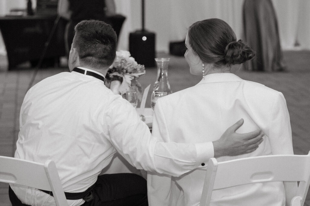 real-wedding-feature black and white photo of husband and wife - husband gave his jacket to his wife in a real wedding feature