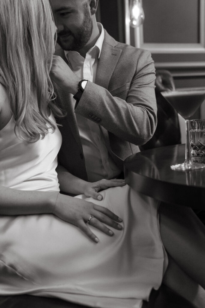 engagement-photo-tips Intimate black and white close-up of a couple during their Cincinnati engagement session at a cocktail lounge, captured as part of creative engagement photo tips.