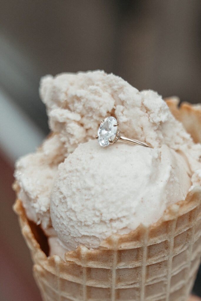 engagement-photo-tips Close-up of an engagement ring resting on a scoop of ice cream in a waffle cone, captured as part of creative engagement photo tips during a Cincinnati session.