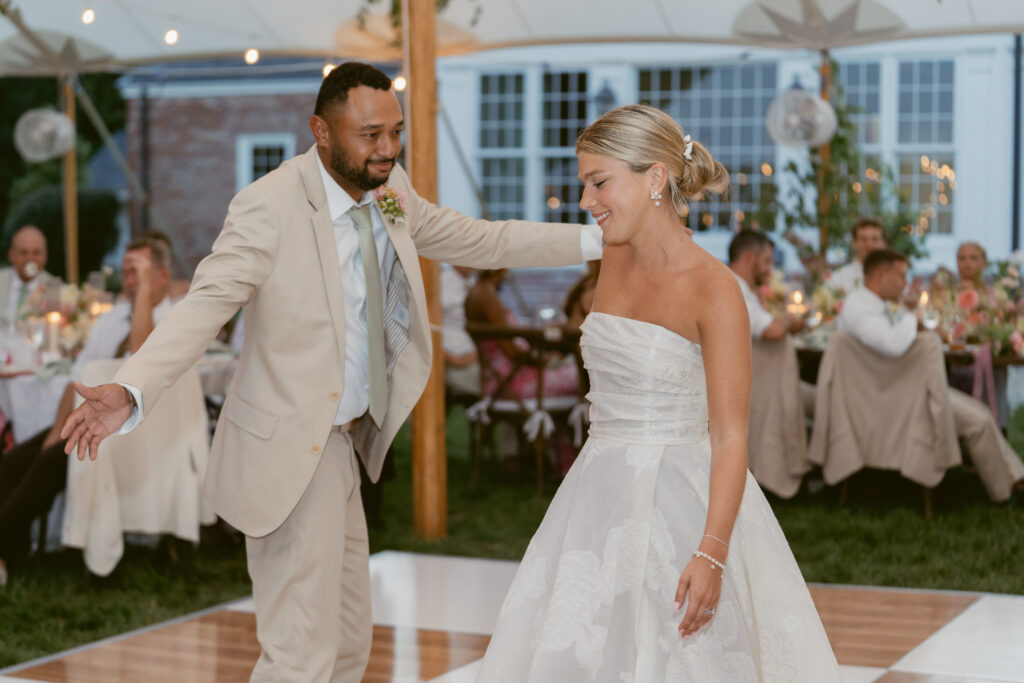 man and woman share their first dance as husband anf wife