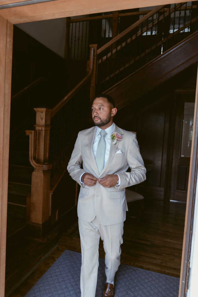 groom walking out the door to go to the wedding ceremony - Wedding at Meshewa House