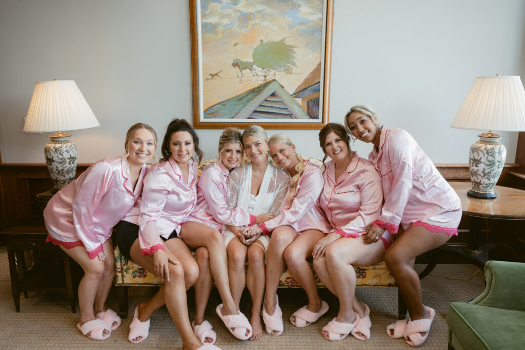 bride and her bridesmaids sitting on a couch at a wedding Meshawa house