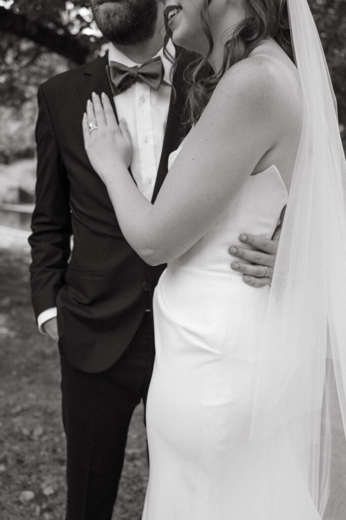 Close-up of bride and groom embracing and laughing during their Downtown Cincinnati Wedding portraits.