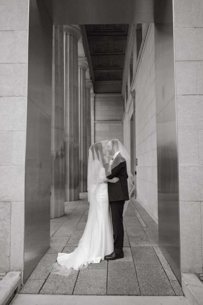 Bride and groom share a quiet moment under their veil during a Downtown Cincinnati Wedding.