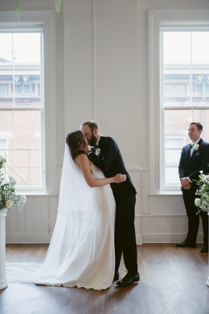 groom kissing the bride during their downtown Cincinnati wedding