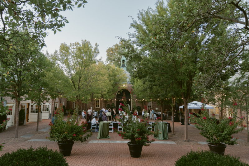 Guests gather for cocktail hour in the courtyard during an elegant Ohio garden wedding at Kingwood.