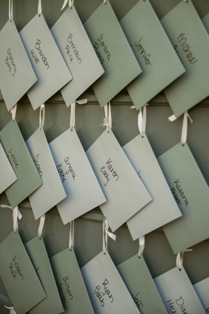 Close-up of guest name envelopes containing handwritten notes at a heartfelt Ohio garden wedding.