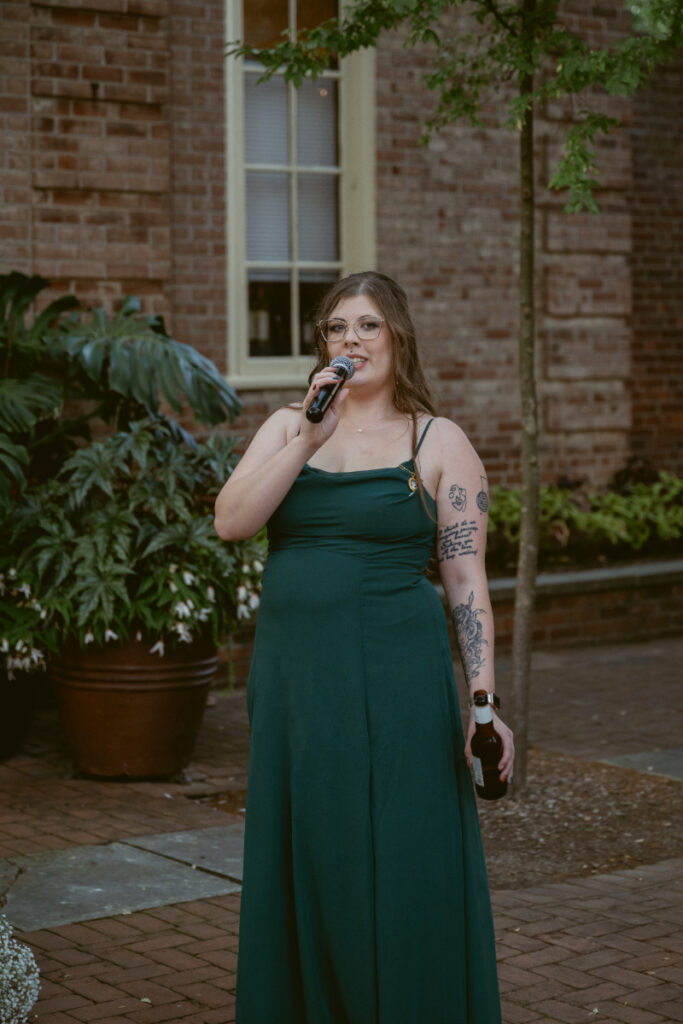 Bridesmaid gives a heartfelt speech during an outdoor reception at an Ohio garden wedding.