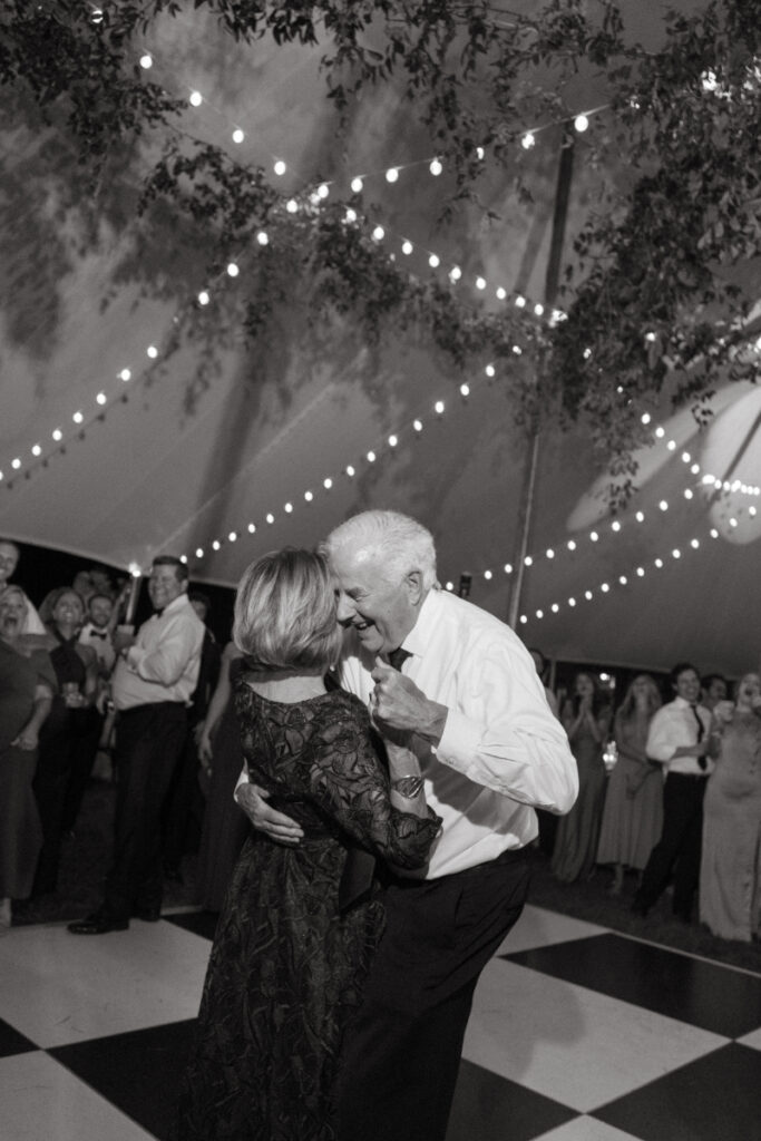 black and white picture of wedding guests dancing