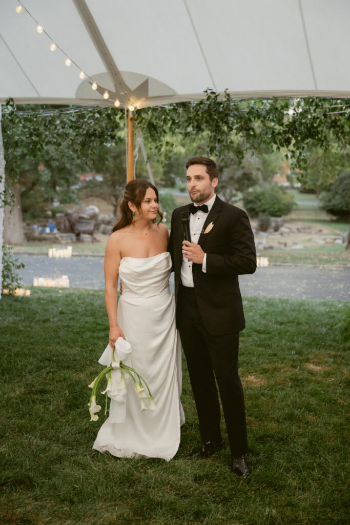 bride and groom making a speech on their wedding day