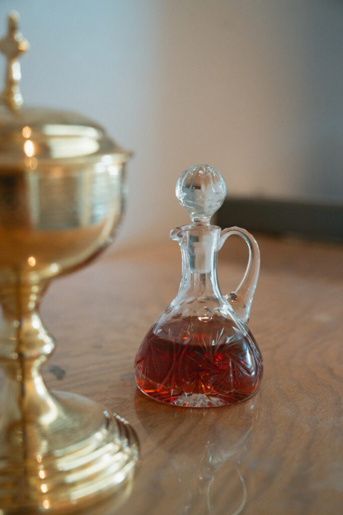 Glass cruet of wine used during Catholic ceremony before a traditional Laurel Court wedding.