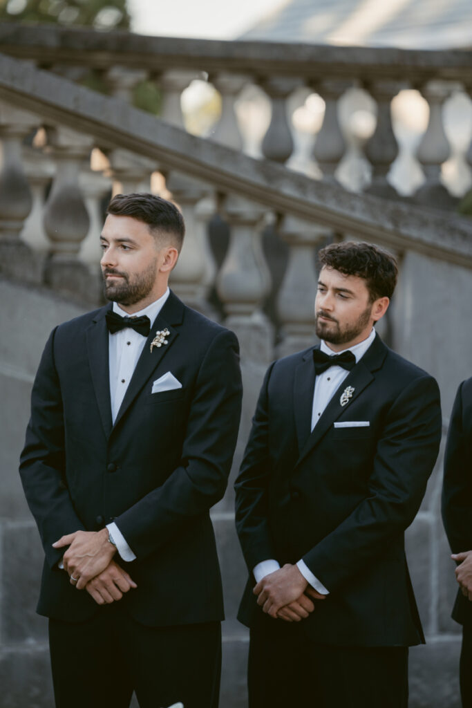 Bridesmaids in black dresses holding calla lilies at elegant Laurel Court wedding in Cincinnati, Ohio.