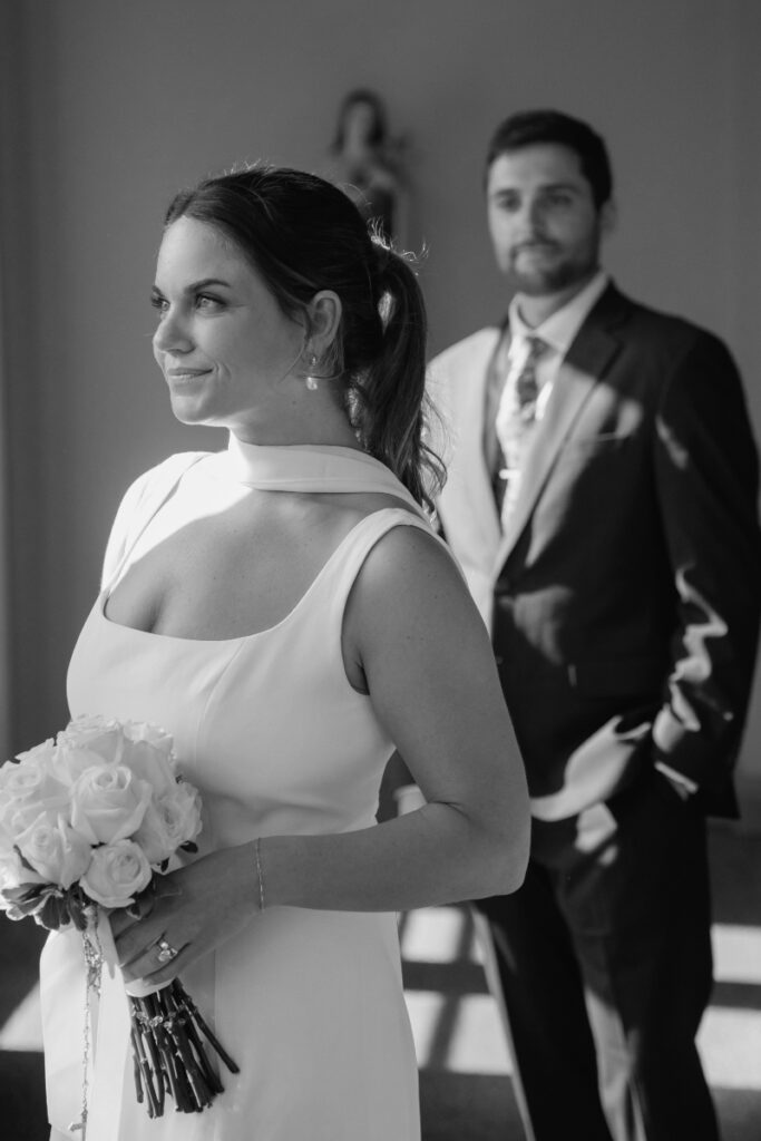 Bride and groom share a quiet moment in soft light during their Laurel Court wedding.
