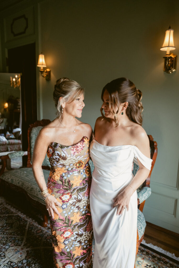Bride smiling with her mother in the bridal suite before the Laurel Court wedding ceremony.