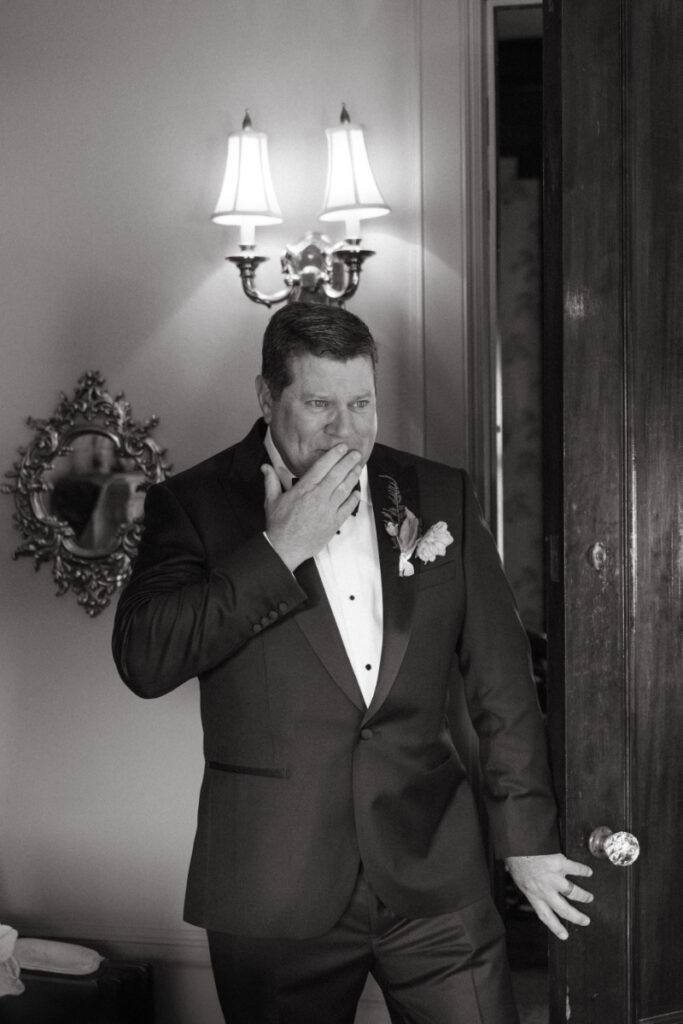 Father of the bride getting emotional during first look before a Laurel Court wedding.