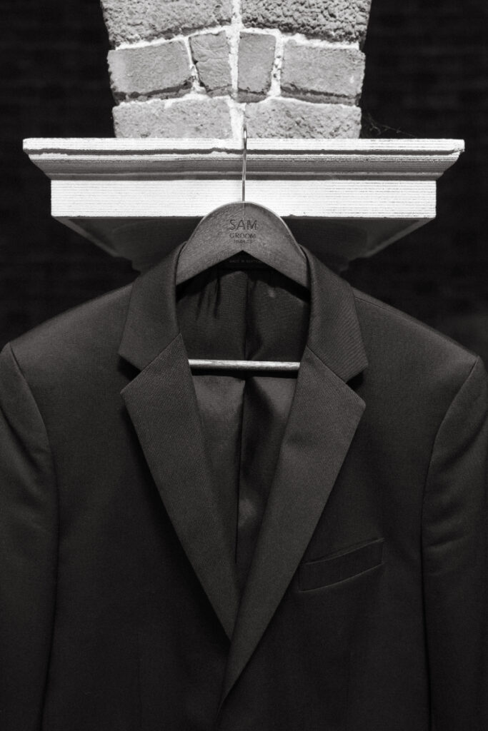 Groom’s suit jacket hanging on custom hanger before getting ready for a Laurel Court wedding.