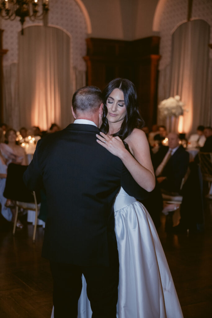 The bride shares a sweet, emotional dance with her father during the wedding reception.