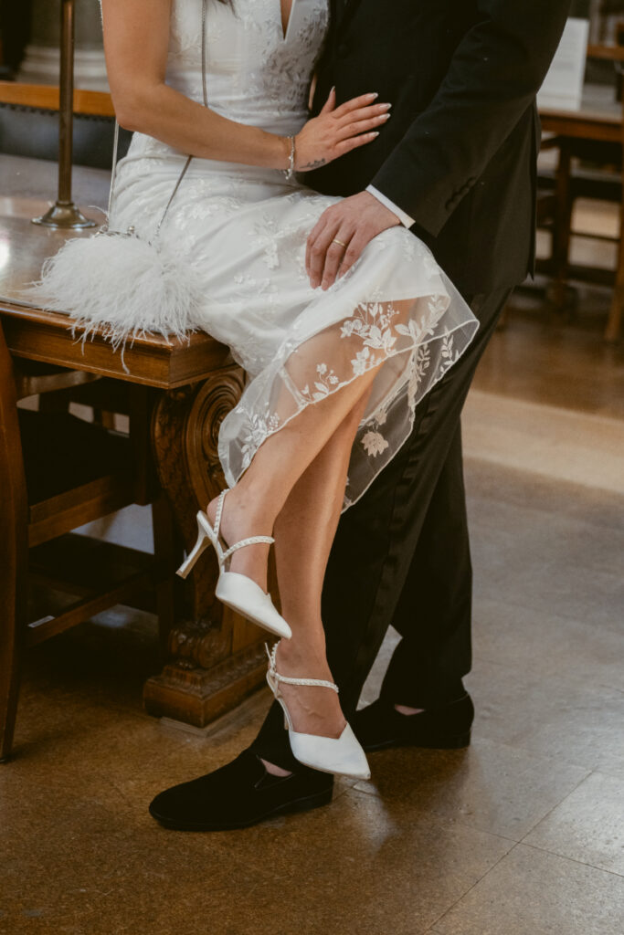 Bride’s heels and lace dress detail during elegant Valentine’s Day wedding.