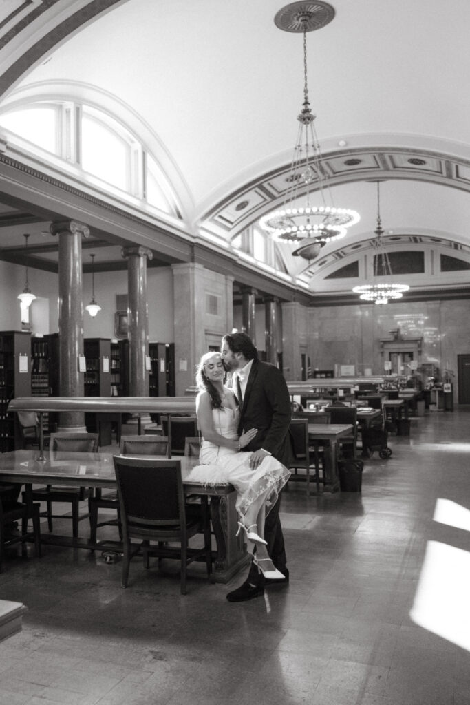 Black and white portrait of couple inside courthouse during Valentine’s Day wedding.