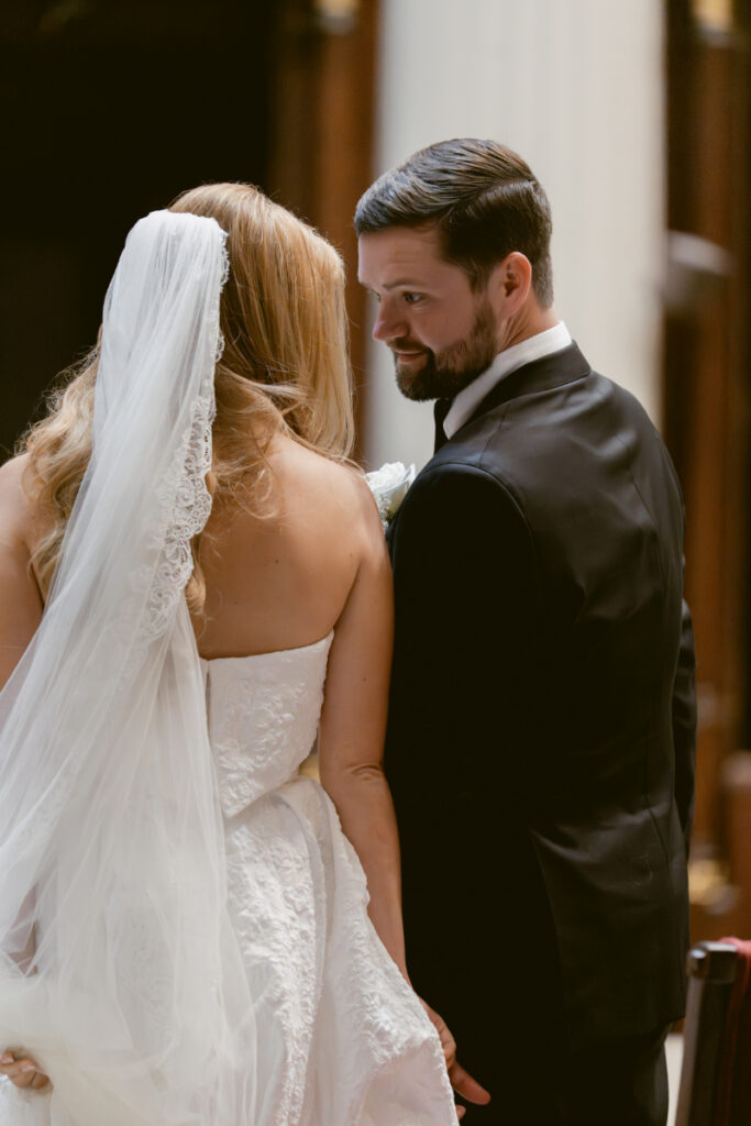Bride and groom sharing a glance during the ceremony.