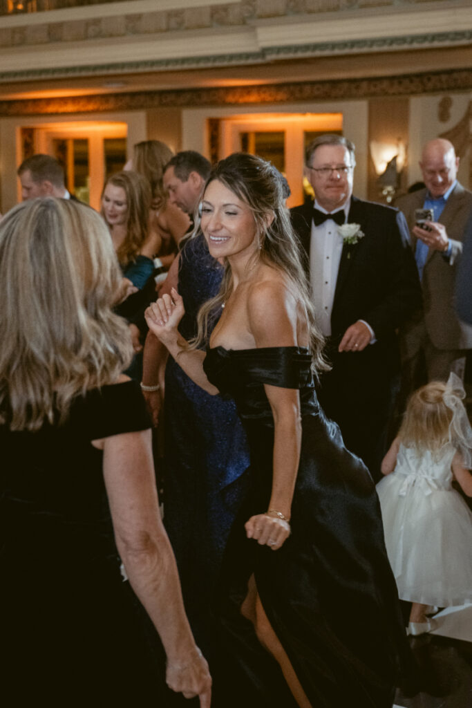 Guests sharing a dance together on the dance floor.