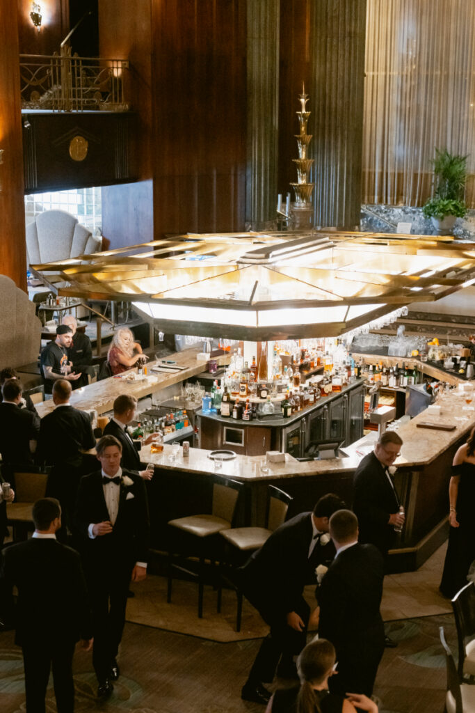 Overhead view of the bar area and guests mingling during cocktail hour.