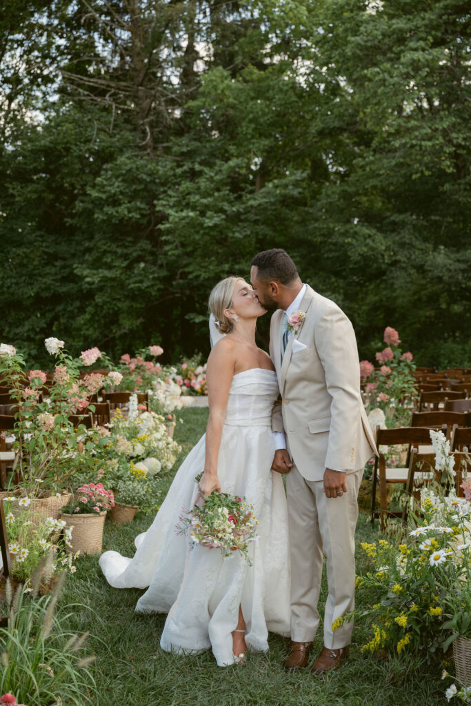 Bride and Groom kiss at their Meshewa House Garden Wedding