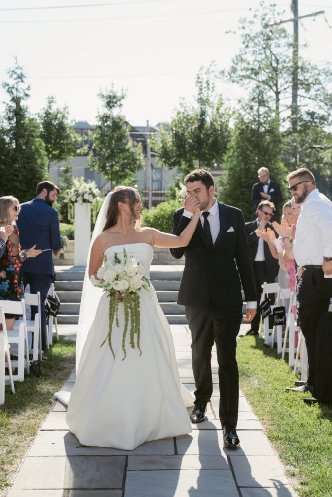 Bride and groom walk down the aisle after saying "I do" at one of our favorite Ohio wedding venues.